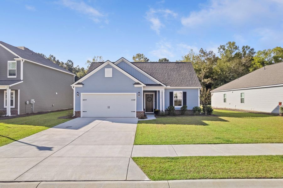 Front exterior of a new home in Cedar Glen Preserve, Huger, SC, highlighting curb appeal (Image 2).