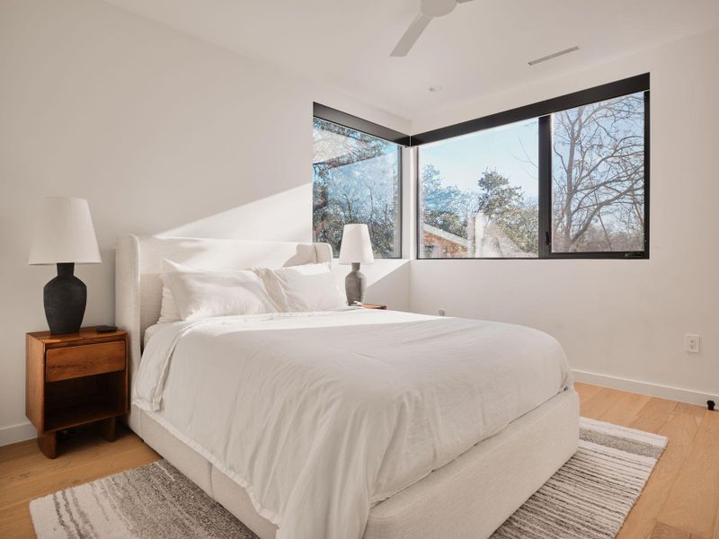 Bedroom featuring light wood-style floors and ceiling fan