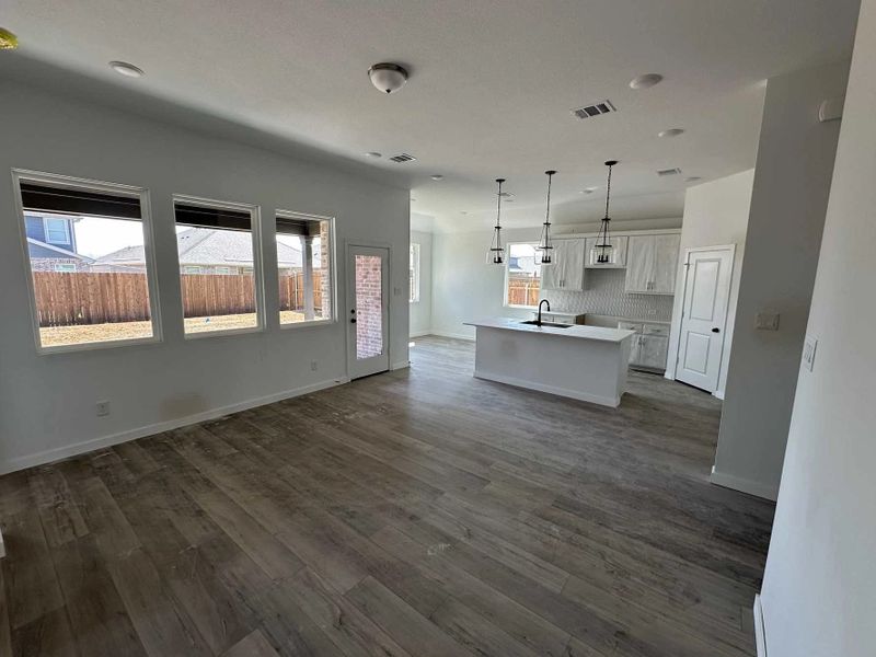 Open Kitchen-Living-Dining Room Construction Progress featuring the Harmony Collection