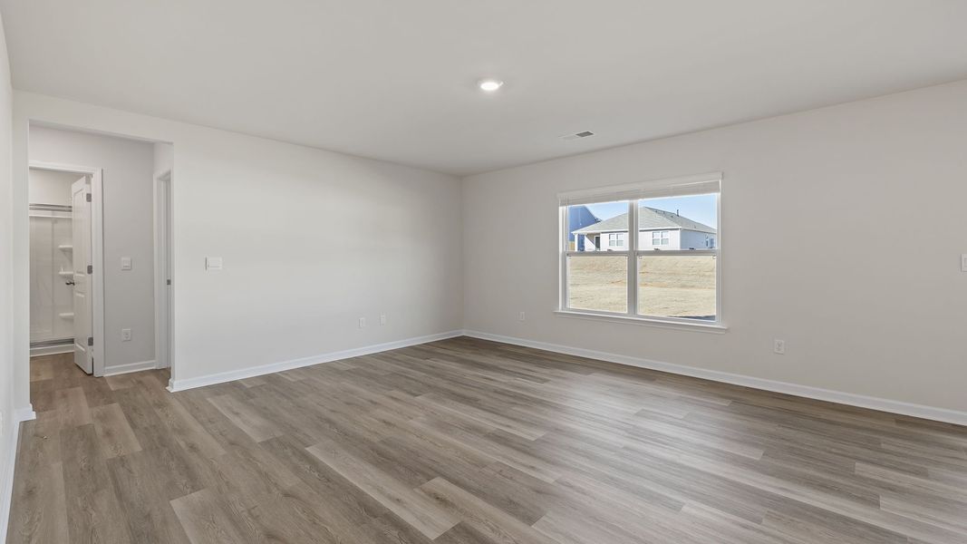 Spacious, unfurnished interior of a new home in Bentley Park, Greenwood (Image 19).
