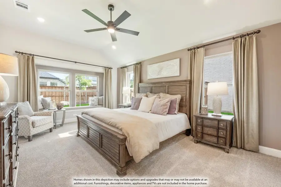 Master bedroom with wood bed frame, ceiling fan, carpet flooring, and large windows with neutral drapes Master bedroom with wood bed frame, ceiling fan, carpet flooring, and large windows with neutral drapes