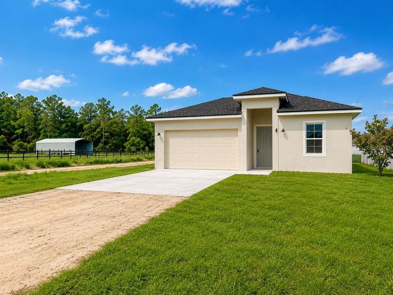 Front exterior of a new home in , Deland, FL, highlighting curb appeal (Image 20).