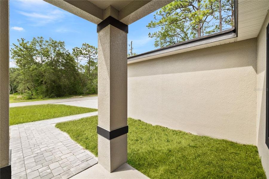 Exterior details and patio area of a home in , Citrus Springs (Image 16).