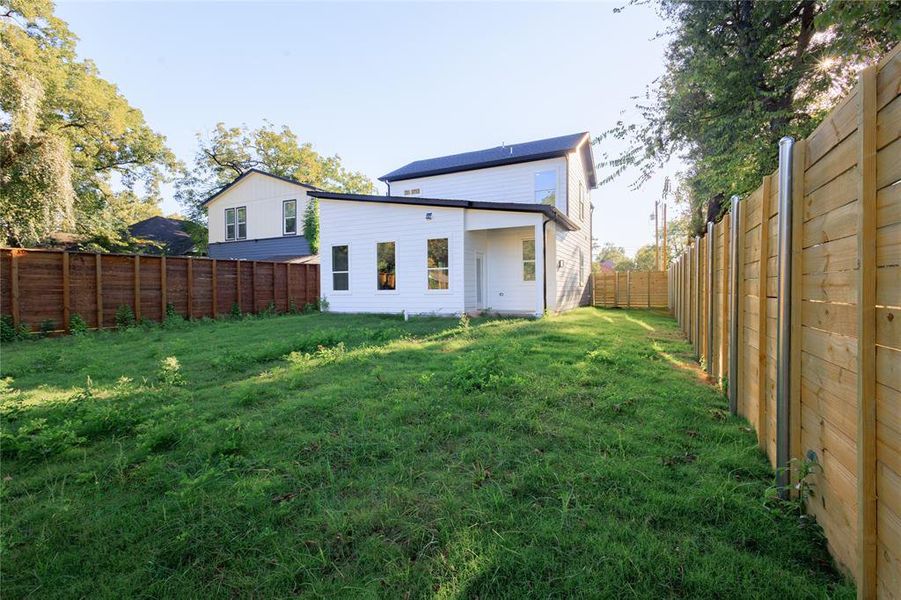 Rear view of property with a fenced backyard Rear view of property with a fenced backyard