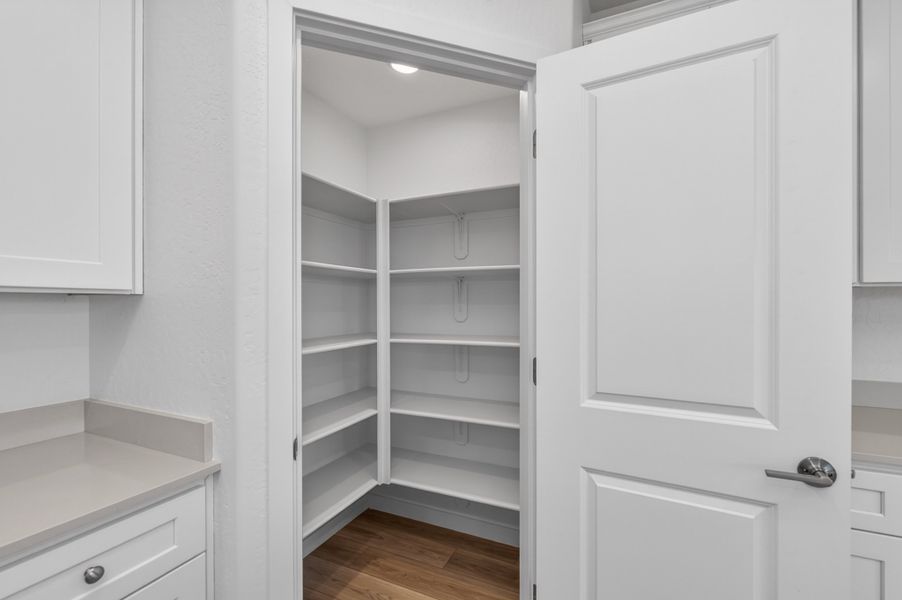 A white cabinet in a room. A white cabinet in a room.