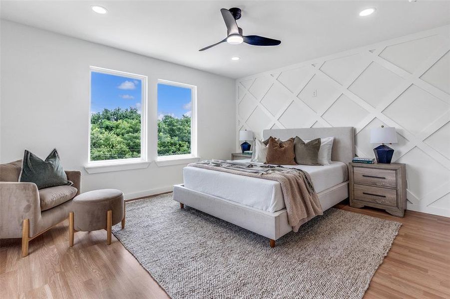 Bedroom with light wood-style floors, ceiling fan, and recessed lighting Bedroom with light wood-style floors, ceiling fan, and recessed lighting