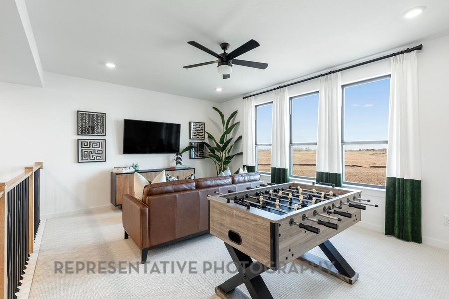 Game room with baseboards, recessed lighting, a ceiling fan, and light carpet