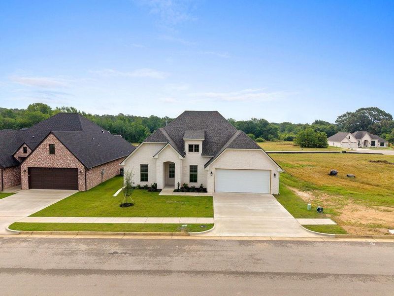 Front exterior of a new home in , Tyler, TX, highlighting curb appeal (Image 20).