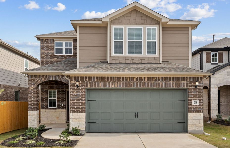 Front exterior of a new home in Crosswinds, Kyle, TX, highlighting curb appeal (Image 1). Front exterior of a new home in Crosswinds, Kyle, TX, highlighting curb appeal (Image 1).