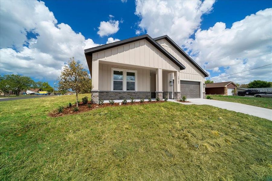 Front exterior of a new home in , Spring Hill, FL, highlighting curb appeal (Image 31).