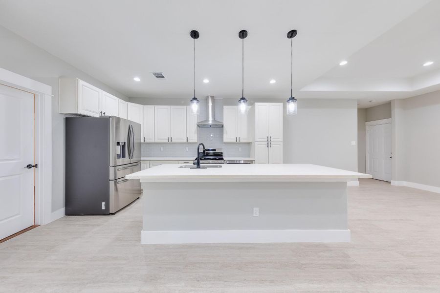 Brand-new kitchen featuring sleek countertops, modern cabinetry, and stainless steel appliances—perfect for cooking and entertaining!
