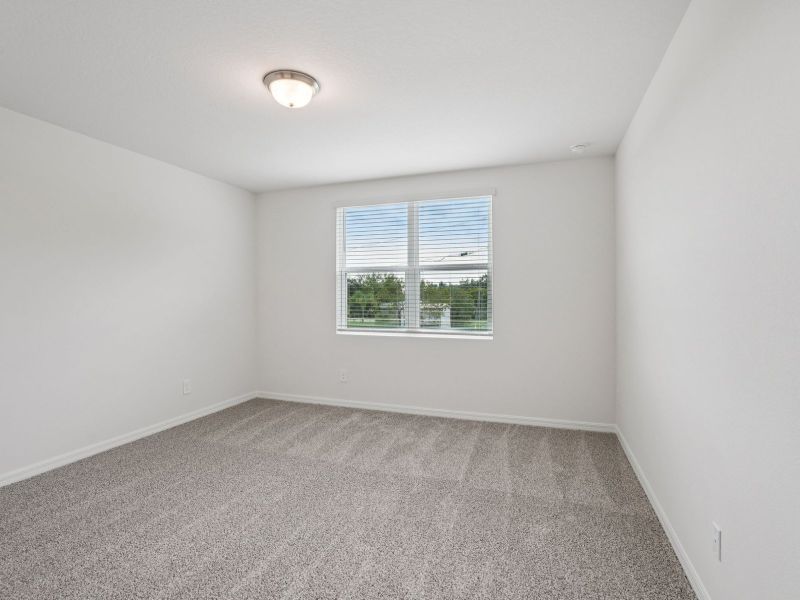 Spacious, unfurnished interior of a new home in Springs at Lake Alfred - Signature Series, Lake Alfred (Image 9).