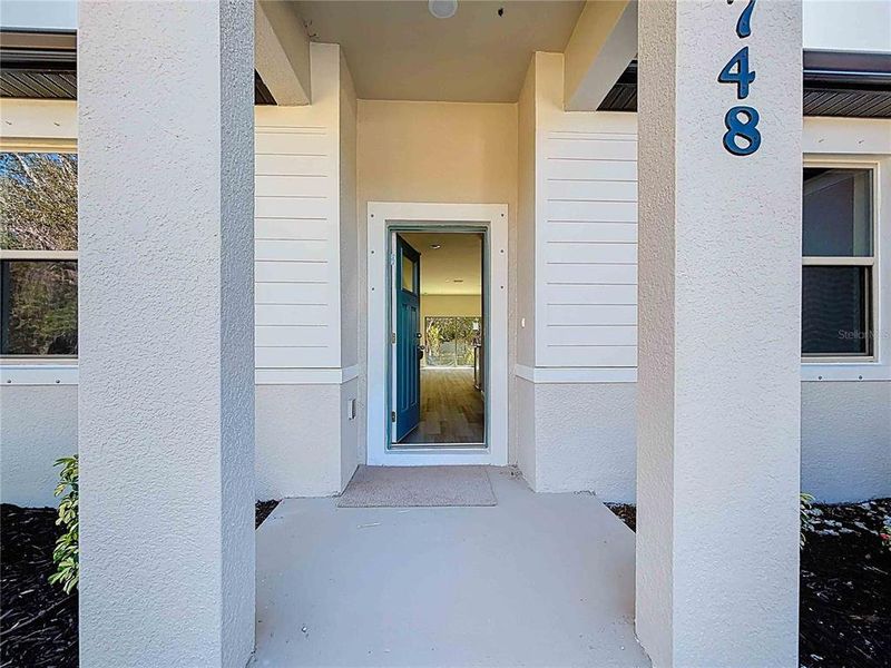 Exterior details and patio area of a home in , North Port (Image 21).