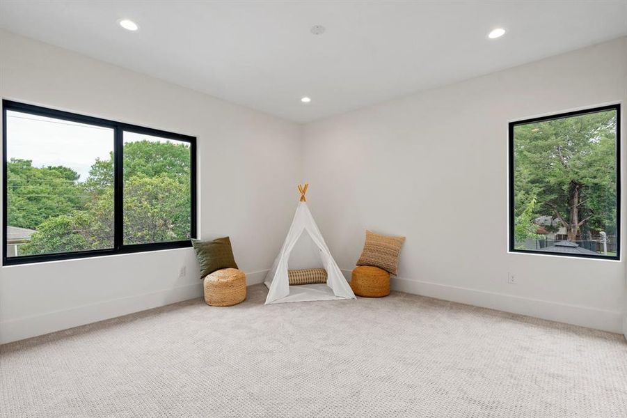 Recreation room featuring recessed lighting and carpet Recreation room featuring recessed lighting and carpet