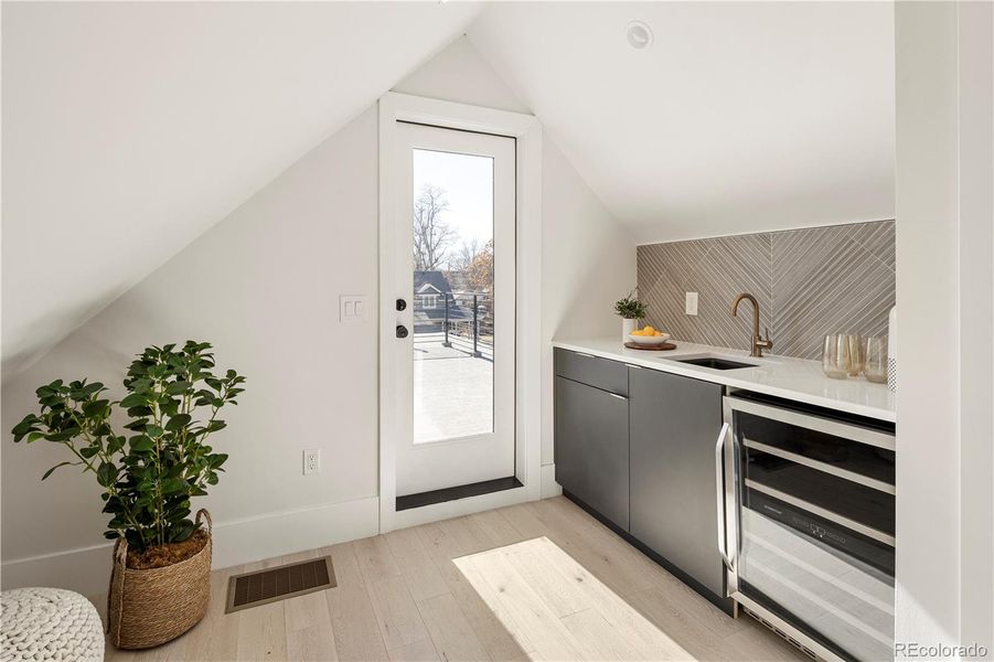 Third floor loft space w/ wet bar & beverage fridge