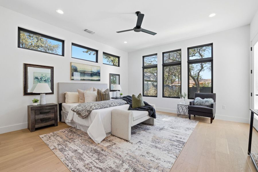 Bedroom featuring ceiling fan, light wood-type flooring, and recessed lighting