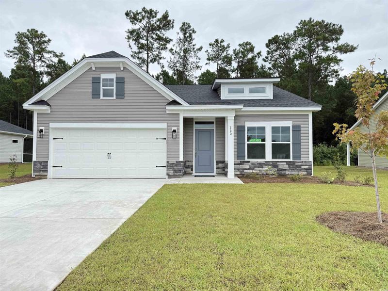 Front exterior of a new home in Beach Gardens, Conway, SC, highlighting curb appeal (Image 1).