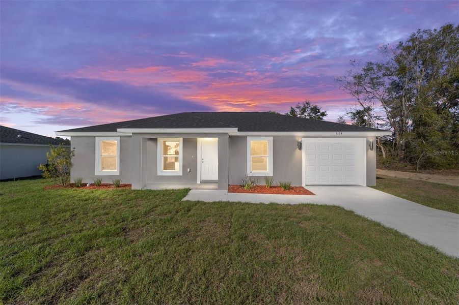 Front exterior of a new home in , Dunnellon, FL, highlighting curb appeal (Image 16).