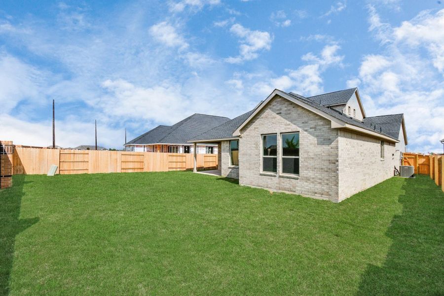 Exterior details and patio area of a home in 50' Traditional Homes at Elyson, Katy (Image 22).