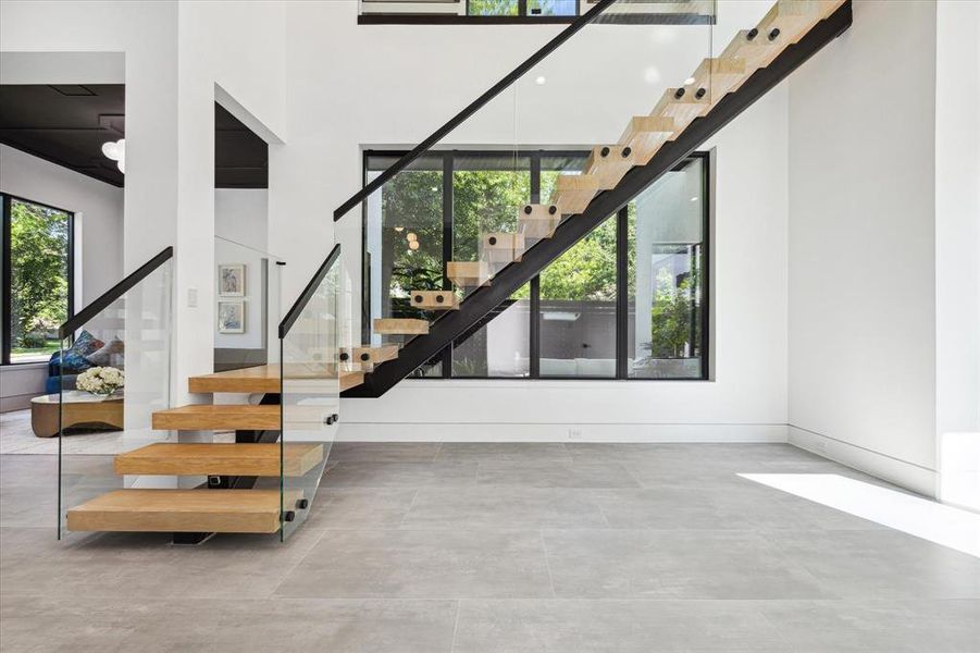 Handsome floating staircase with glass railing