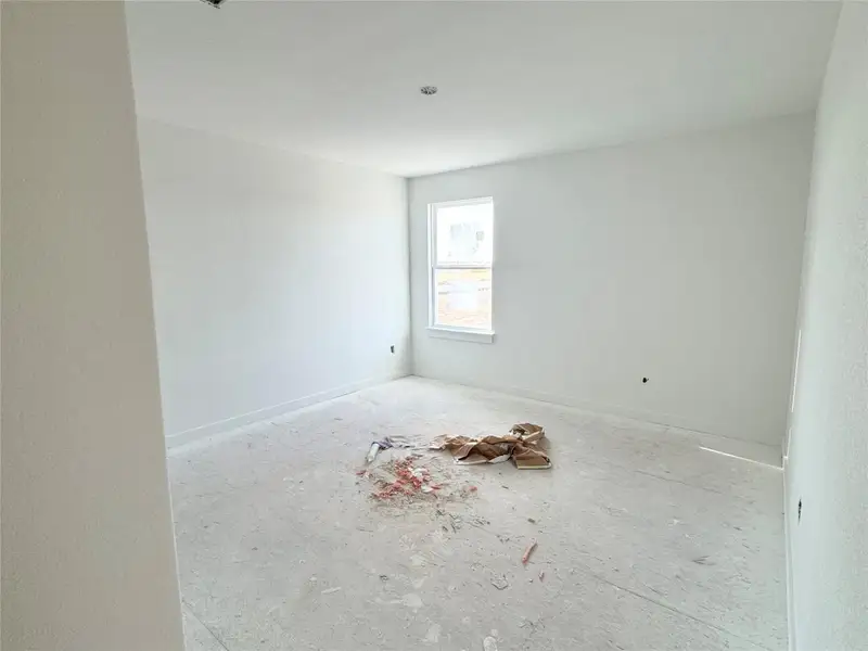 Unfurnished room with baseboards Unfurnished room with baseboards