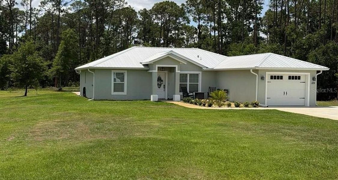 Front exterior of a new home in , Lake Placid, FL, highlighting curb appeal (Image 1). Front exterior of a new home in , Lake Placid, FL, highlighting curb appeal (Image 1).