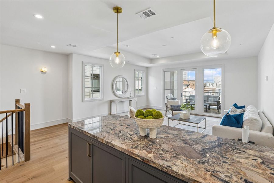 The fourth-floor City Room is this home's secret entertainment retreat. With plenty of room for games, television, or just relaxing, this will become your favorite room. With a large wet bar at one end and covered terrace at the other, this room just waits for your inspiration.