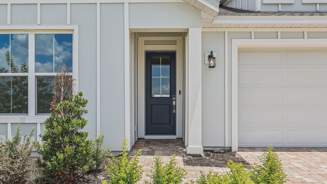 Longleaf Floor Plan Exterior Front Entry by DRB Homes in Lakeside at Satilla in New Homes St. Cloud
