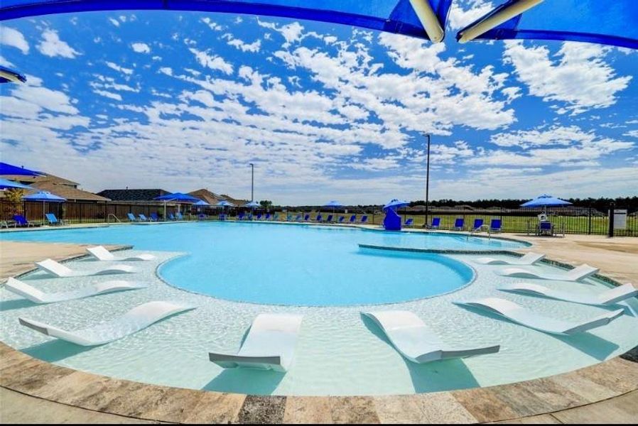 Resort-style pool, you're lounging by the resort-style pool, the sun is warm but not too hot