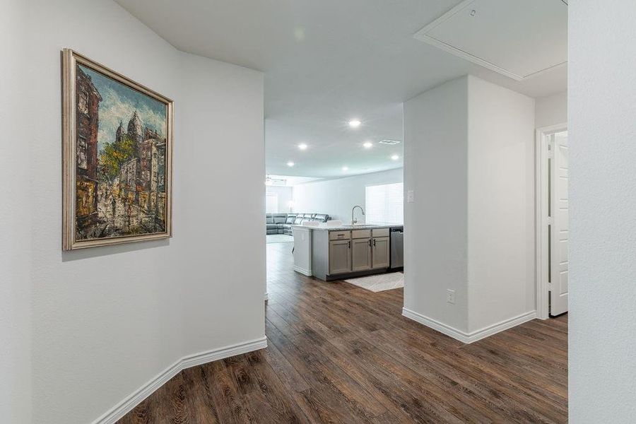 Foyer with views into open kitchen and den Foyer with views into open kitchen and den