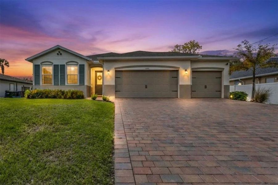 Front exterior of a new home in , North Port, FL, highlighting curb appeal (Image 2). Front exterior of a new home in , North Port, FL, highlighting curb appeal (Image 2).