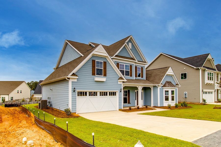 Front exterior of a new home in Palmetto Shores, Chapin, SC, highlighting curb appeal (Image 22).