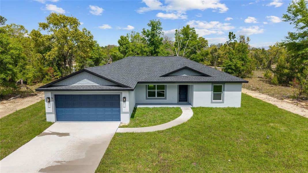 Front exterior of a new home in , Ocklawaha, FL, highlighting curb appeal (Image 21).