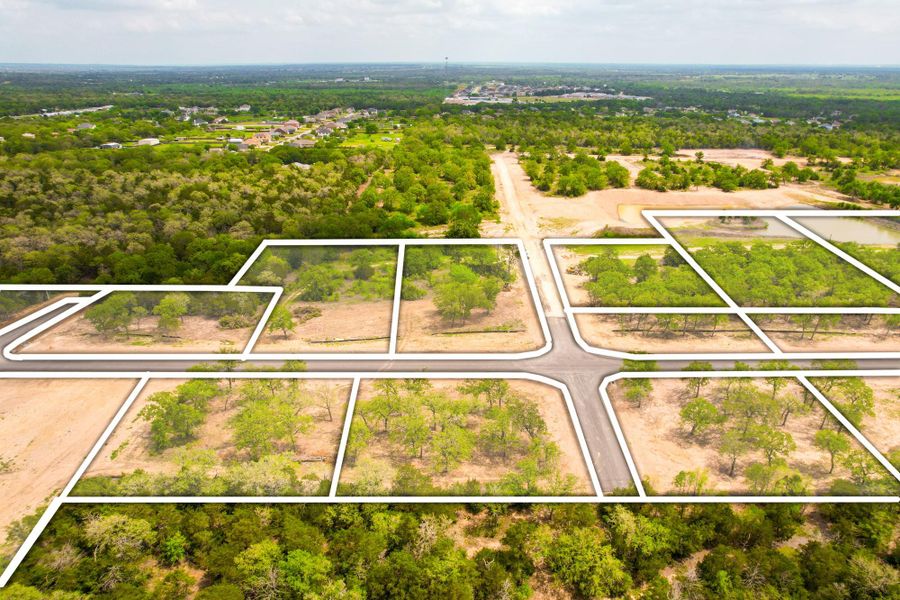 Prime acreage with mature trees and new roads, ready for building your dream home.