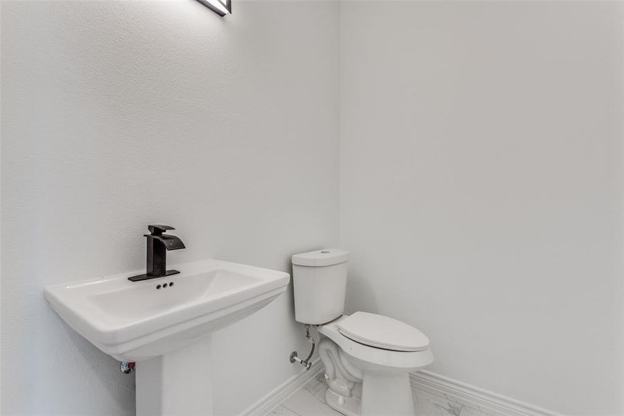 Bathroom with sink and toilet