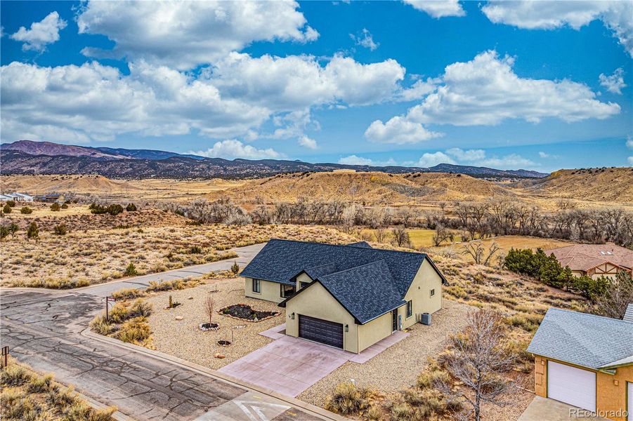 Front exterior of a new home in , Cañon City, CO, highlighting curb appeal (Image 24). Front exterior of a new home in , Cañon City, CO, highlighting curb appeal (Image 24).