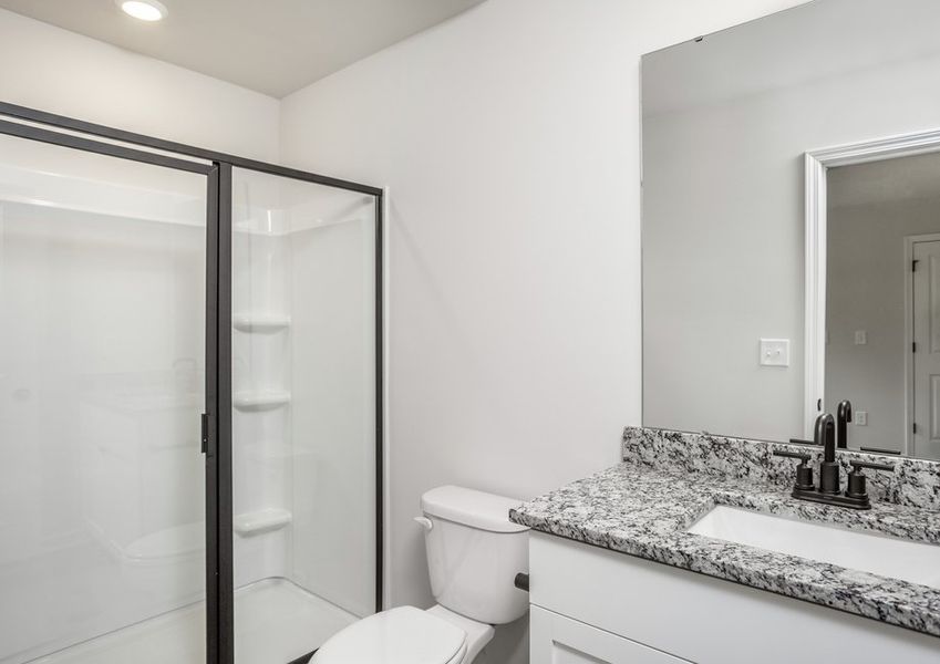 The master has a glass-enclosed shower.