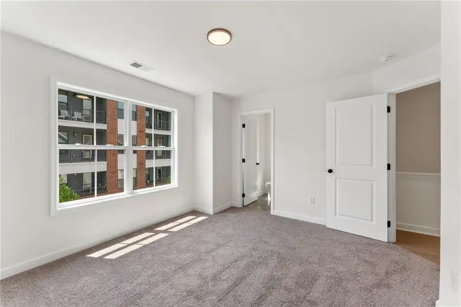 Spacious, unfurnished interior of a new home in Townes at South Main, Kennesaw (Image 17).