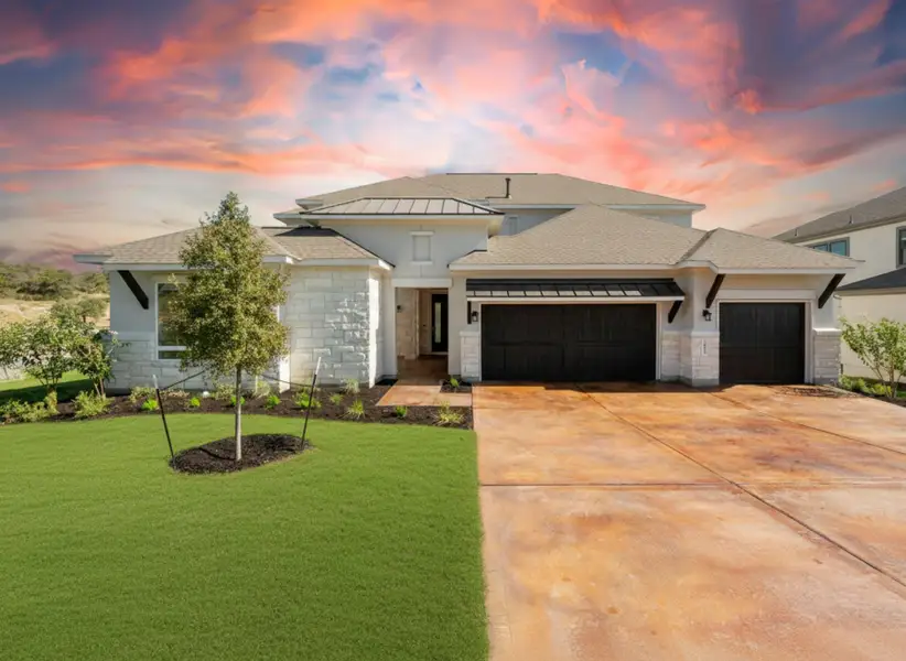 Front exterior of a new home in Rough Hollow, Lakeway, TX, highlighting curb appeal (Image 1). Front exterior of a new home in Rough Hollow, Lakeway, TX, highlighting curb appeal (Image 1).