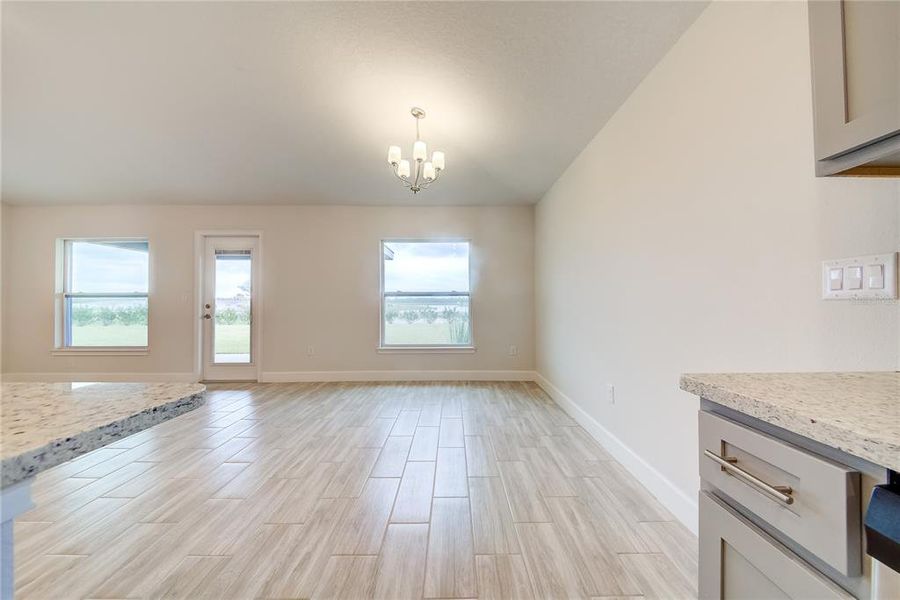 Spacious, unfurnished interior of a new home in Aviary at Rutland Ranch, Parrish (Image 11).