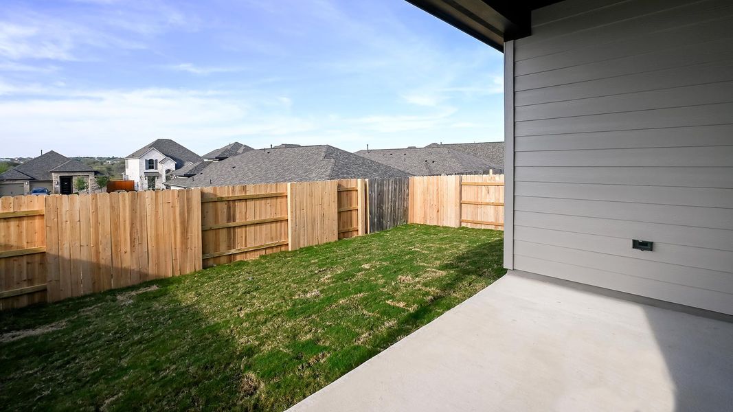Exterior details and patio area of a home in Crosswinds 40', Kyle (Image 4).