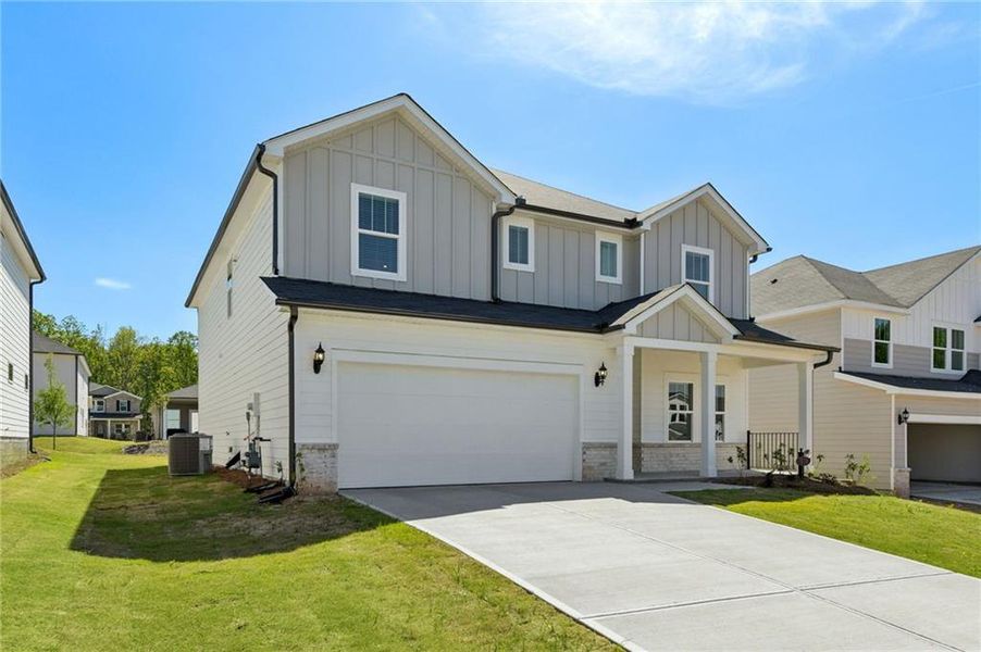 Front exterior of a new home in Vines at Mill Creek - Estate Series, Braselton, GA, highlighting curb appeal (Image 27).