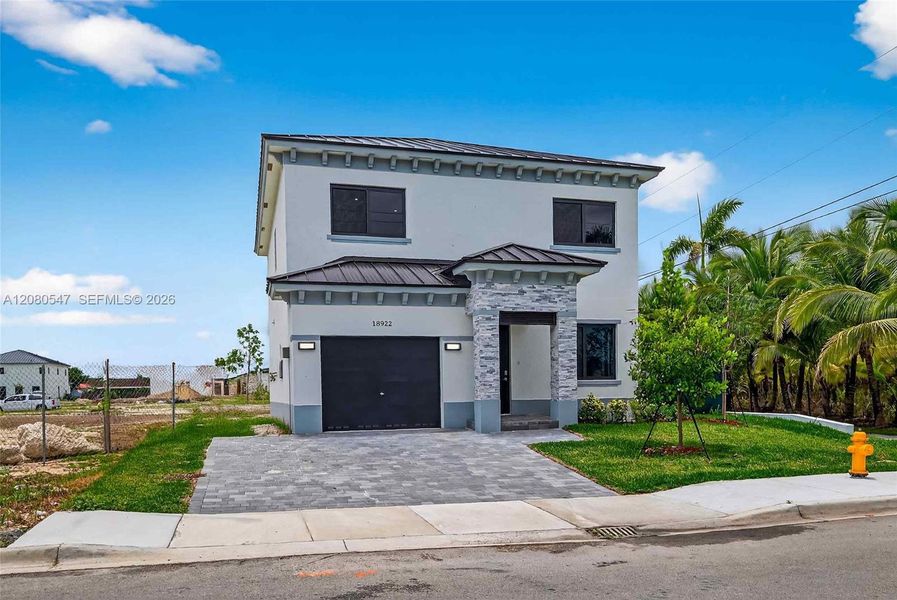 Front exterior of a new home in , Homestead, FL, highlighting curb appeal (Image 23).