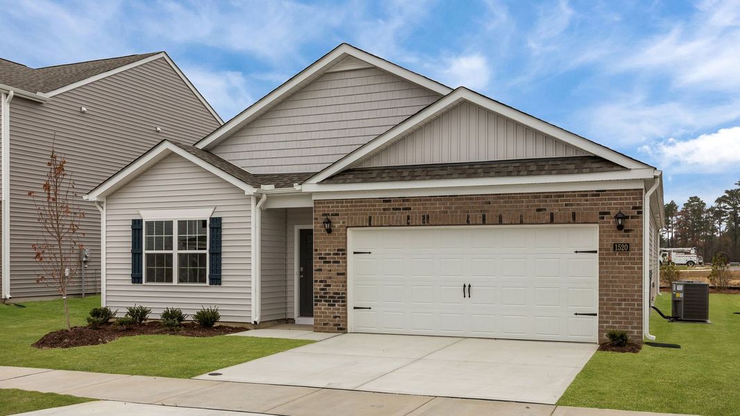 Front exterior of a new home in Ridgewood Farms, Winterville, NC, highlighting curb appeal (Image 2).
