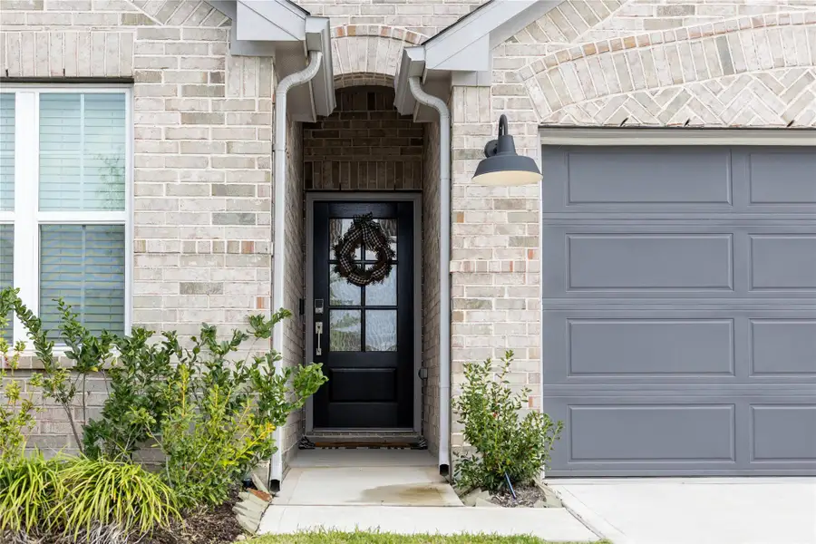 Exterior details and patio area of a home in Pinewood at Grand Texas, New Caney (Image 3).