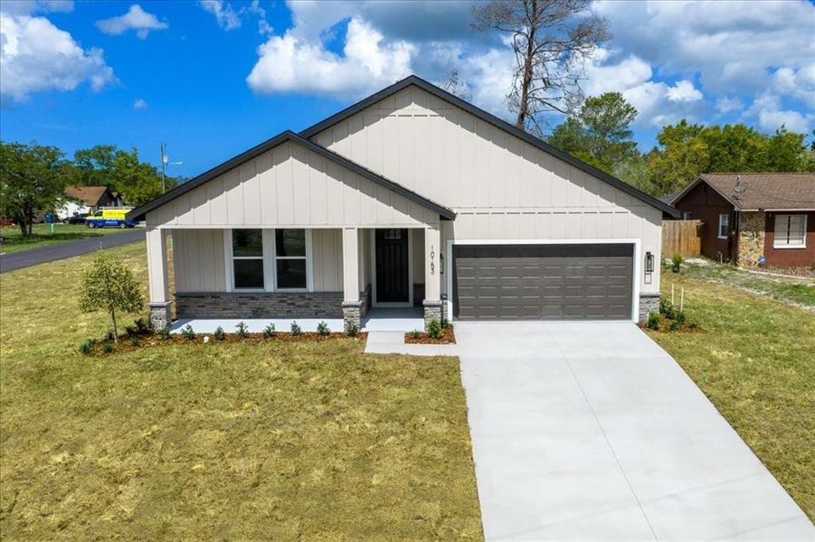 Front exterior of a new home in , Spring Hill, FL, highlighting curb appeal (Image 27).