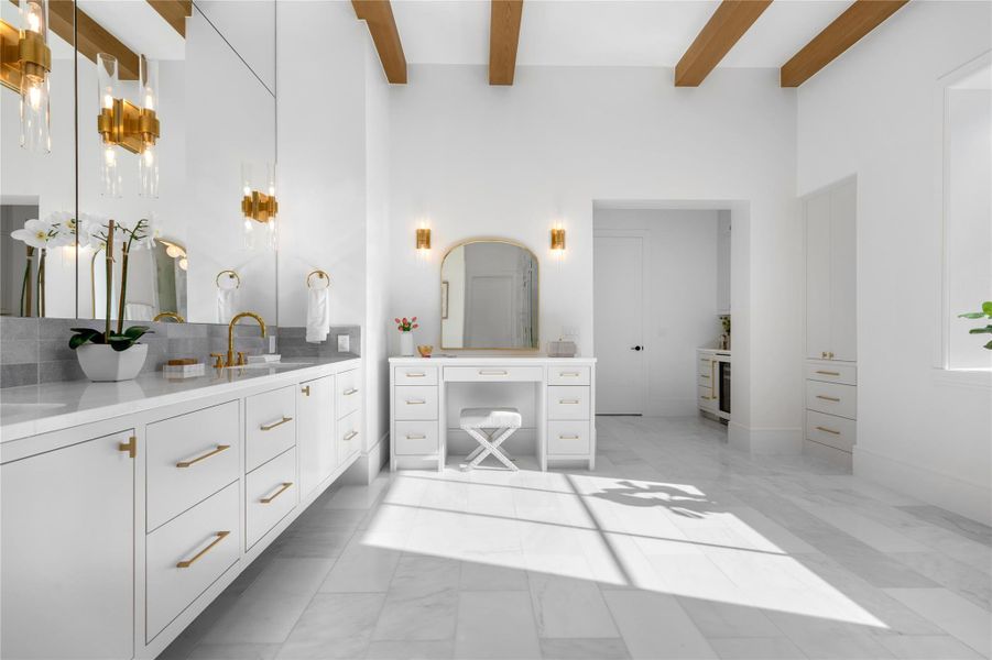 Bathroom with vanity, marble finish floors, and beamed ceiling Bathroom with vanity, marble finish floors, and beamed ceiling