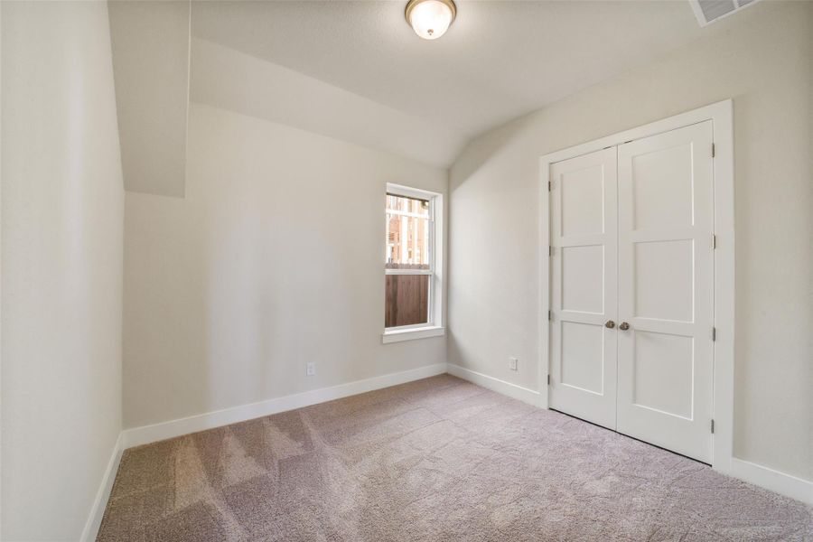 Spacious, unfurnished interior of a new home in Sunterra, Katy (Image 44).