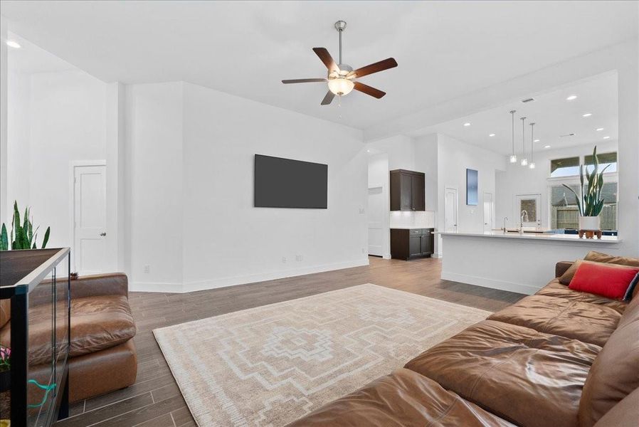 Beautiful wood-look tile flooring extends throughout the home, adding warmth, durability, and a stylish finish to this impressive gathering space. Beautiful wood-look tile flooring extends throughout the home, adding warmth, durability, and a stylish finish to this impressive gathering space.