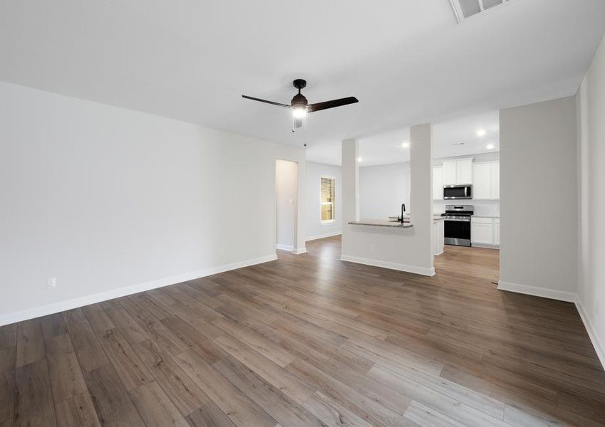 Spacious family room looking into the kitchen